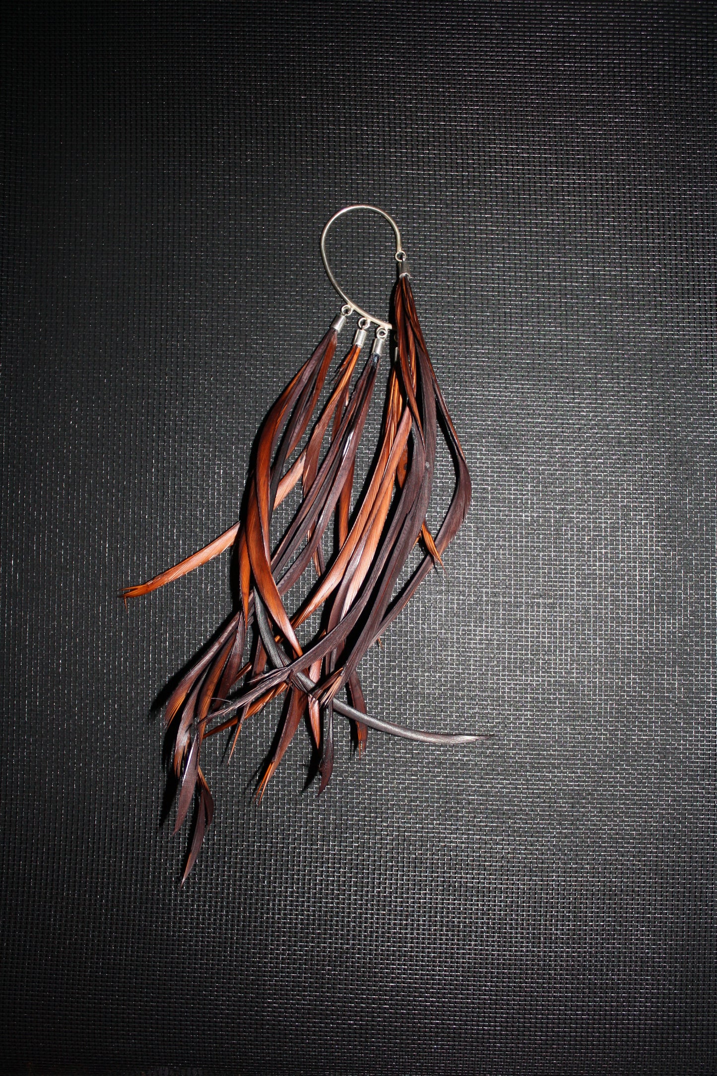 SIlver earhook with feathers